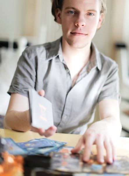 Tom Shayan reading cards